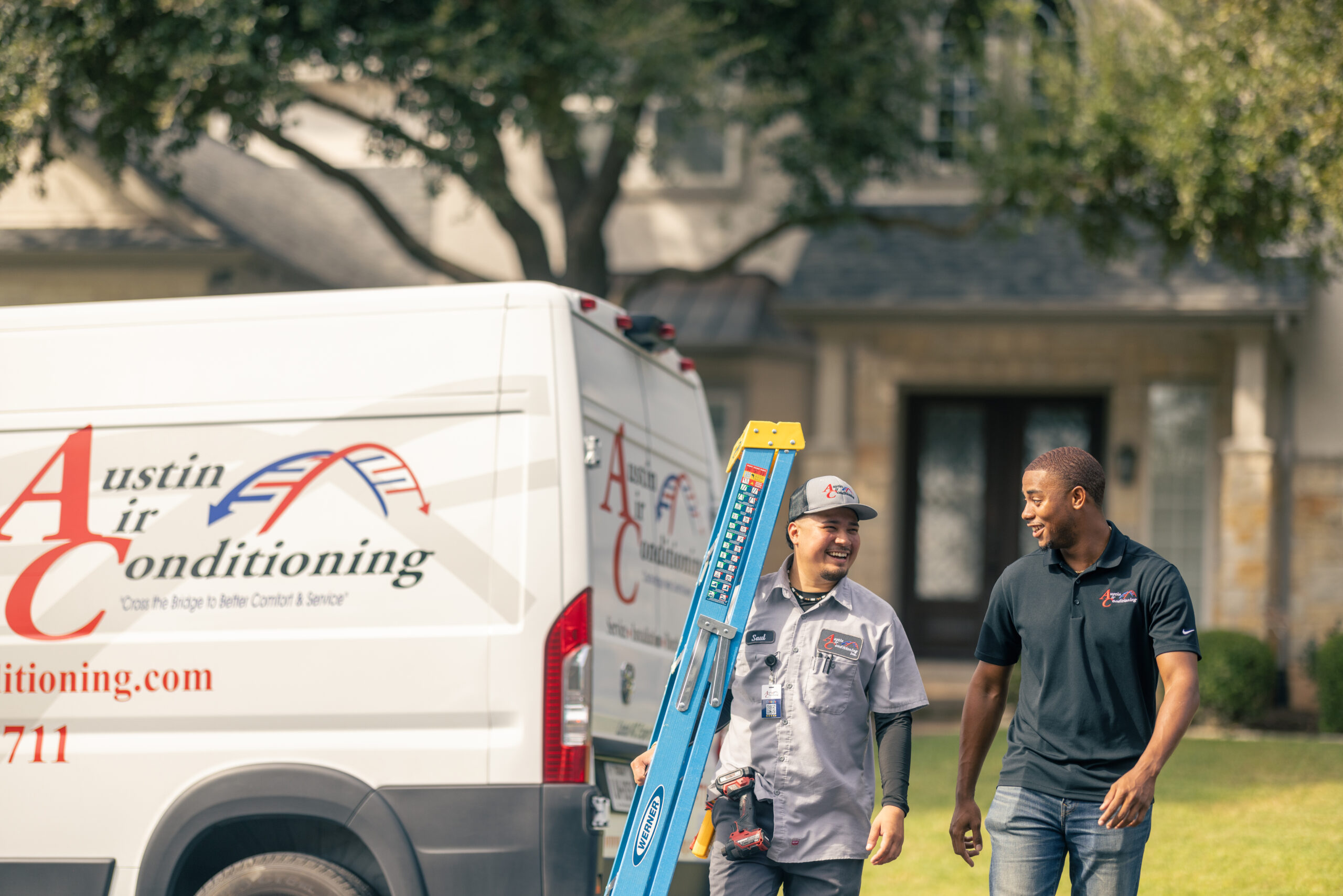 Technicians walking out of home back to service truck